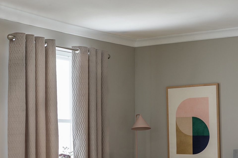 Cream velvet curtains in living room.